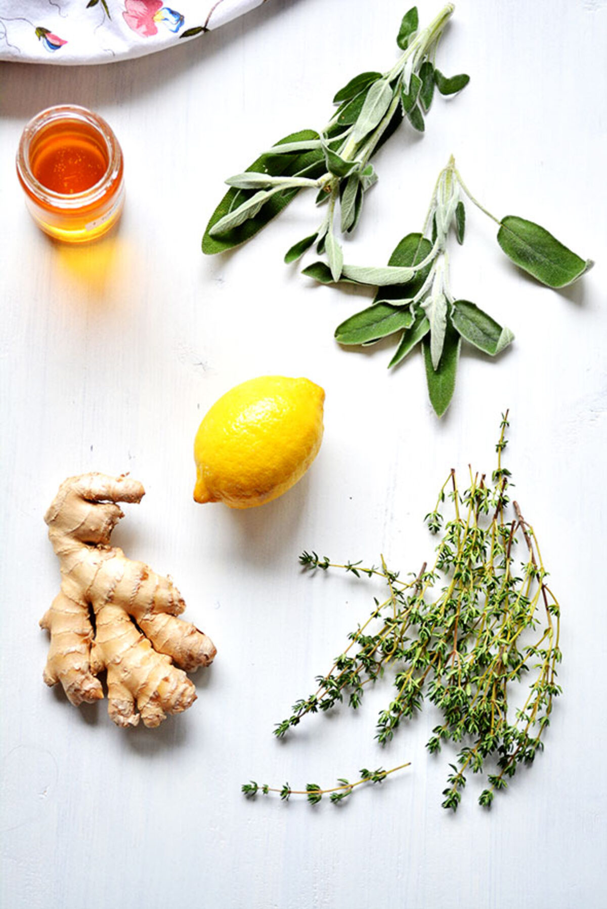Fresh ginger, lemon and herbs — traditional kitchen ingredients used for cough and respiratory comfort